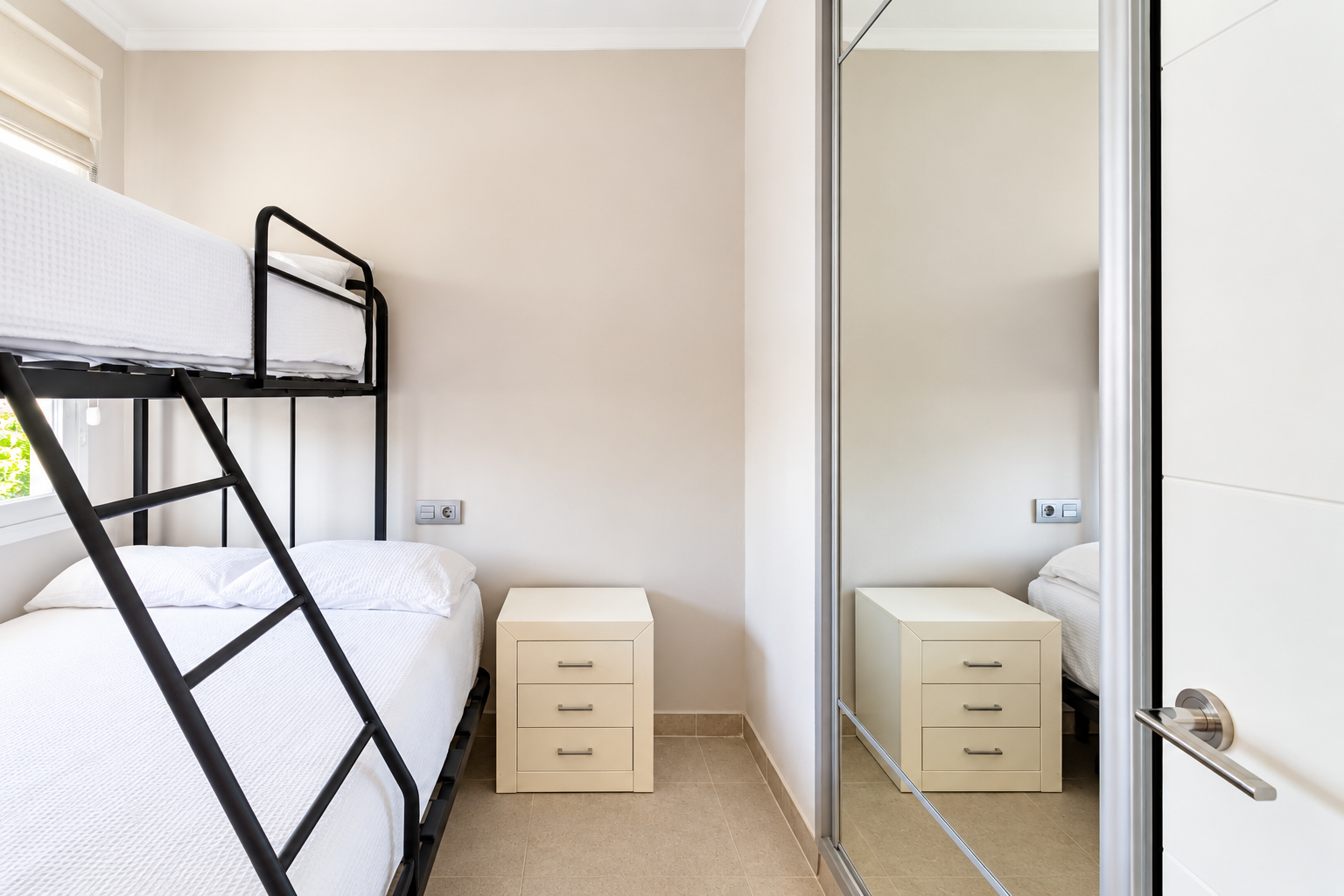 Minimalist Bedroom with Mirrored Wardrobe