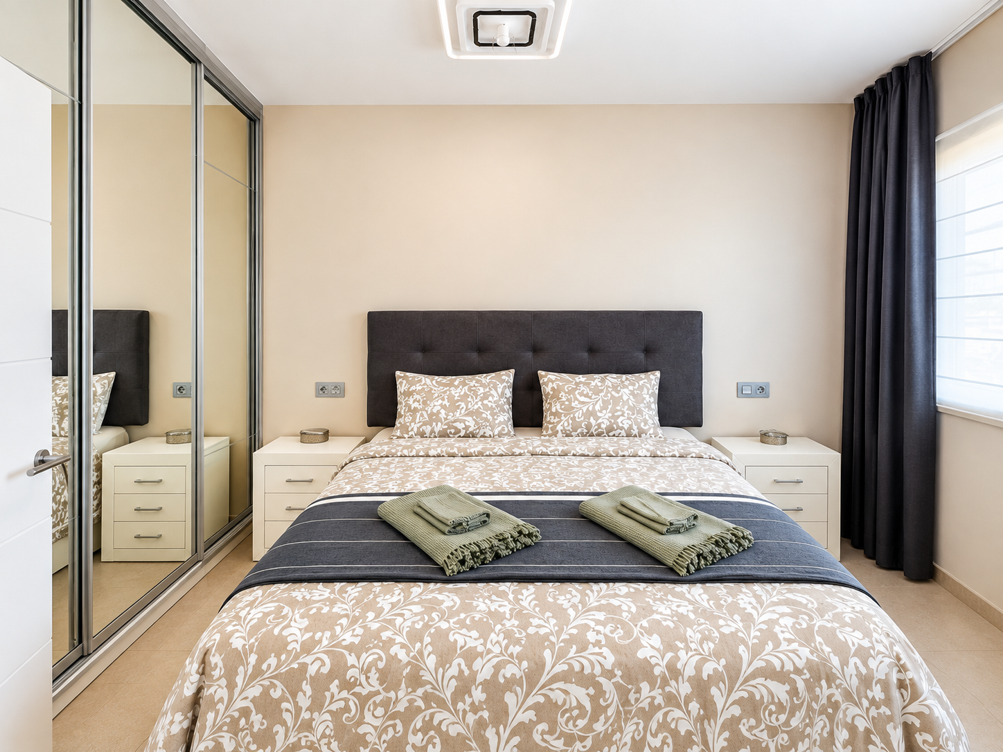 Symmetrical Modern Bedroom with Sage Towels