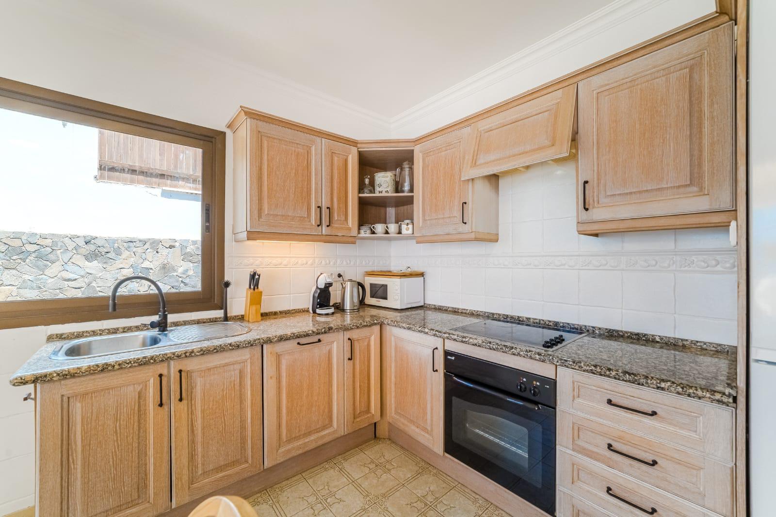 For Holiday Rent Two Bedroom Apartment Ocean View Terrace Swimming Pool Puerto de Santiago Los Gigantes 38 Sunset Dreams by Dream Homes Tenerife Kitchen Real Estate Dream Homes Tenerife